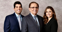 Our ProCare Family Dental doctors—Dr. Perry Danos, Dr. Penelope Danos, and Dr. Antonio Ganios.