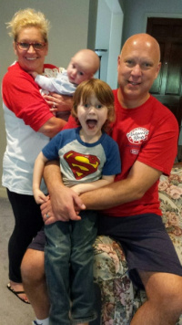 Dr. Connell, his wife LeighAnn with their grandsons