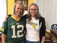 Patient and team member with team spirit at Longmont CO dentist Artistic Smiles
