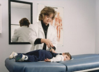 Dr. Murphree adjusting a child.