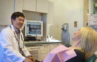 Dr.Kim in one of multiple operatories equit with the latest modern technology.