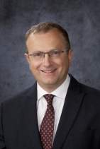 Adrian Caracioni, MD