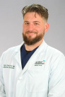 Dr. Gregory de Gruchy, MD