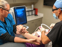 Dr. Silva and nurse performing ultrasound-guided injection therapy using bone marrow concentrate. 2