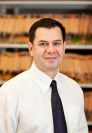 Dr. Emmanuel e Kandkhorov, DDS