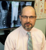 Dr. Andrew J Strauss