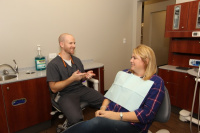 Dr. Fisher interacting with a patient. 4