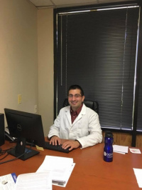 Our dentist Dr. Moumtaz in his office at Aces Dental Flagstaff AZ 7
