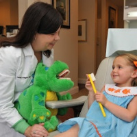 Dr. Ashley Covington with one of cute little patients 1