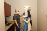 Dr. Fisher working the X-ray machine. 1