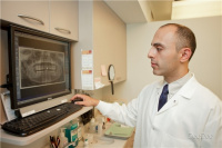 Dr. Ifraimov reviewing digital x-rays 2