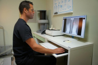 Dr. Wee reviewing patient's foot X-rays 3
