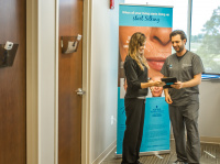 Dr. Skandamis consults with team member at Universal Dermatology & Vein Care 1