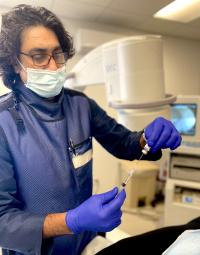 Dr. Zaki Anwar preparing an injection 6